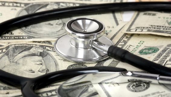 Image of stethoscope on top of ten dollar bills