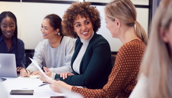 Image of business women discussing in a meeting