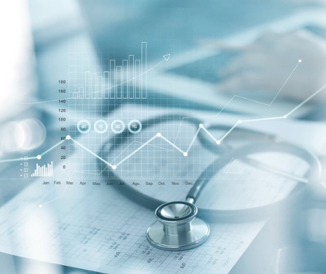Image of Stethoscope on top of papers with graphs and a graphic overlay of financial information