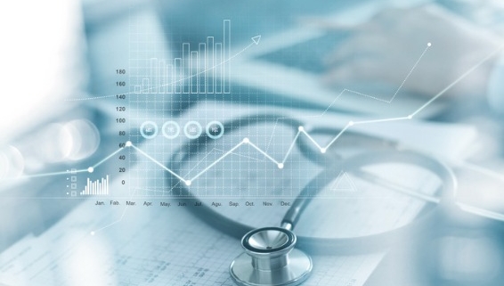 Image of Stethoscope on top of papers with graphs and a graphic overlay of financial information
