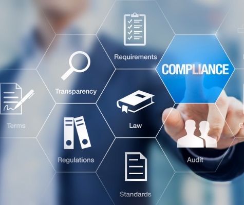 Computer image of a person pointing at an overlay that reads Compliance